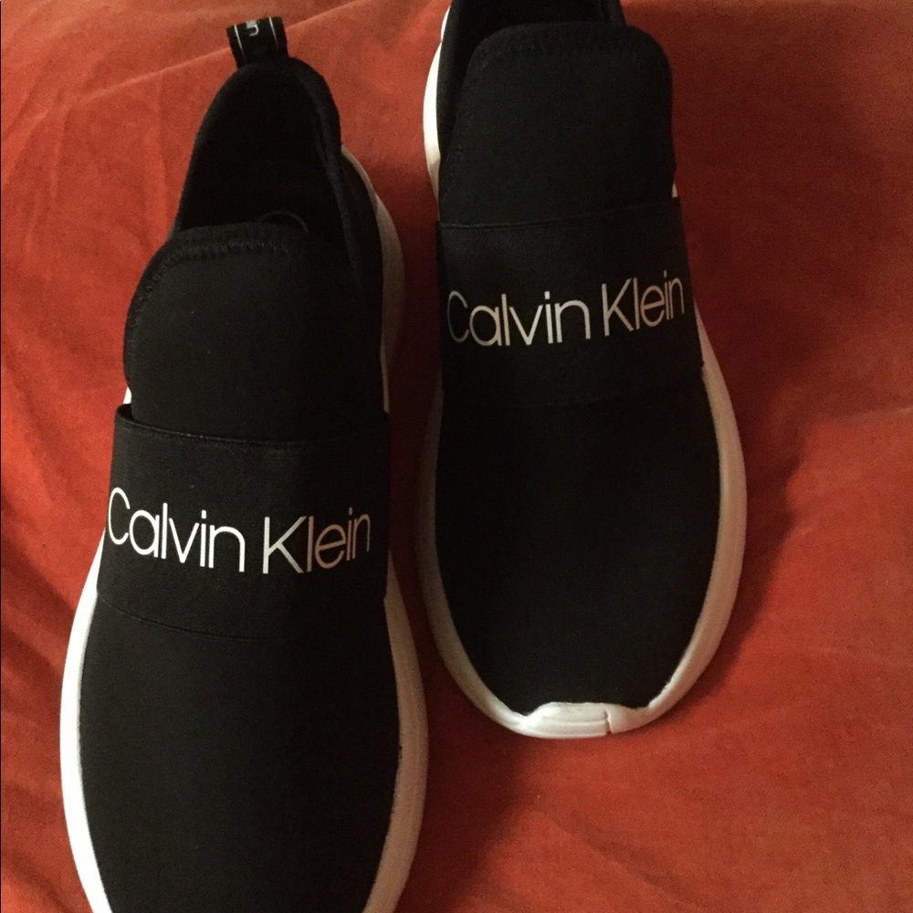 Brand New Calvin Klein slide on sneakers.